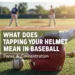what does tapping your helmet mean in baseball
